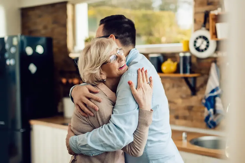 Man hugging elderly parent